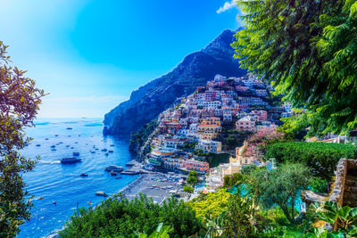 Panoramic shot of sea and buildings against sky