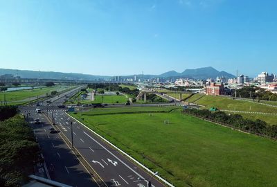 High angle view of city street against clear sky