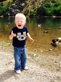 Boy in water at lake