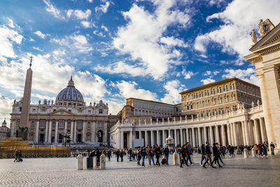 Group of people in front of historic building