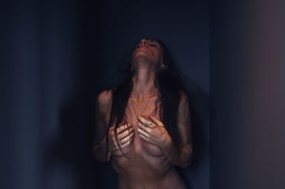 Midsection of a young woman with eyes closed