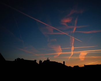 Low angle view of vapor trails in sky