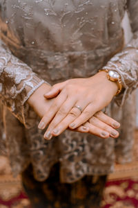 Midsection of woman with hands