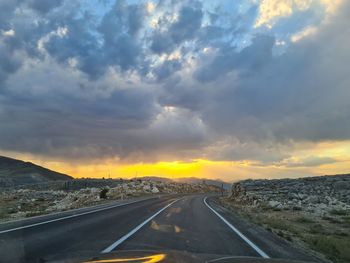 Road against sky during sunset