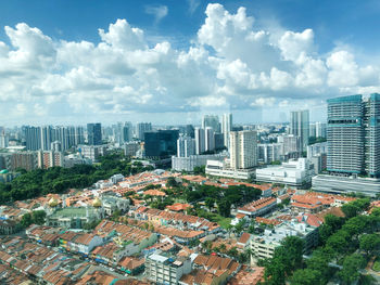 High angle view of modern buildings in city against sky