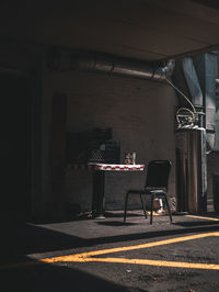 Empty chairs and tables in building