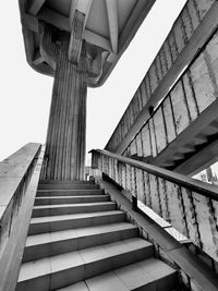 Low angle view of bridge against buildings