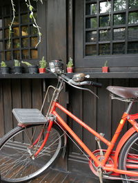 Bicycle parked by railing