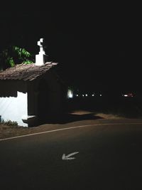 Illuminated building against sky at night