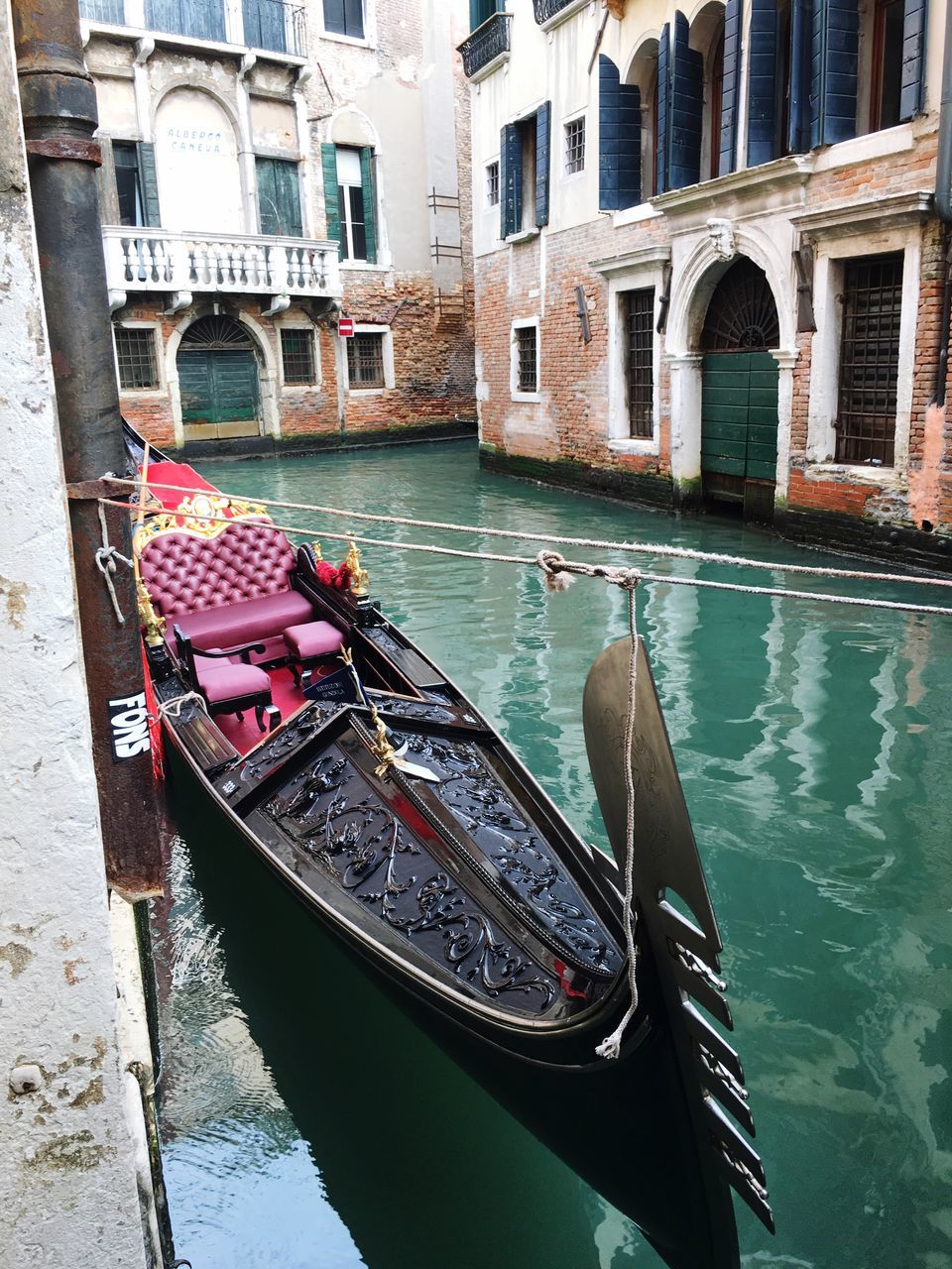 nautical vessel, boat, water, built structure, transportation, architecture, mode of transport, moored, building exterior, canal, waterfront, reflection, day, river, travel, building, outdoors, residential structure, window, residential building