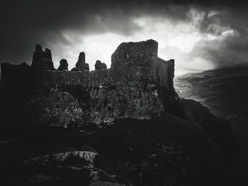 Low angle view of rock formations against sky