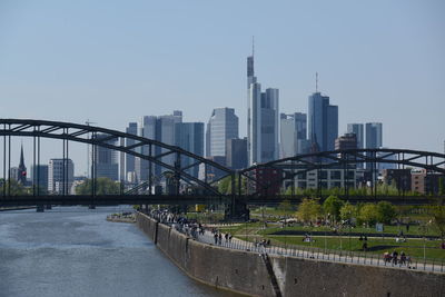 View of bridge and buildings against sky