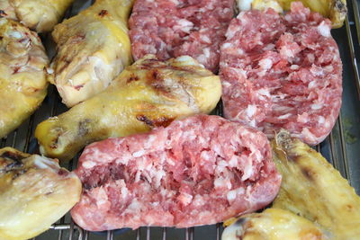 High angle view of meat on barbecue grill