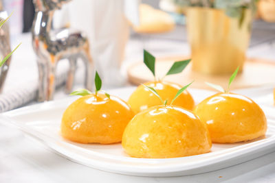 Close-up of fruits in plate on table