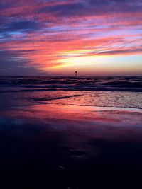 Scenic view of sea against cloudy sky