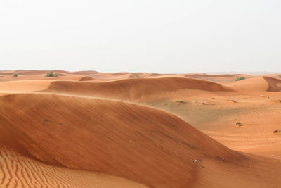 Scenic view of desert against clear sky