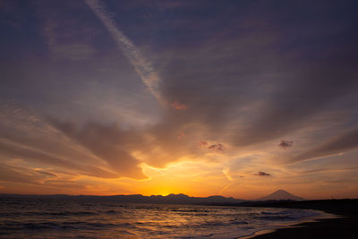 Scenic view of sea against sky at sunset