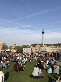 People in city against sky