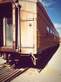 Train on railroad track against sky