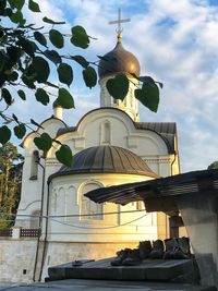 Low angle view of building against cloudy sky