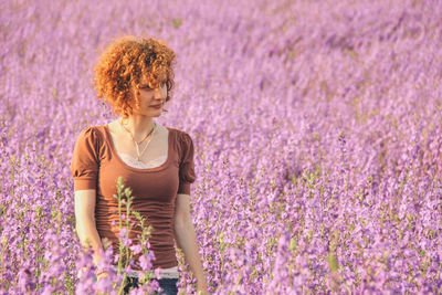 Woman walking on lavender field