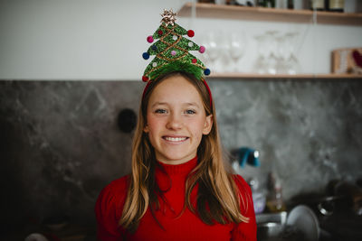 Portrait of smiling girl with christmas headband
