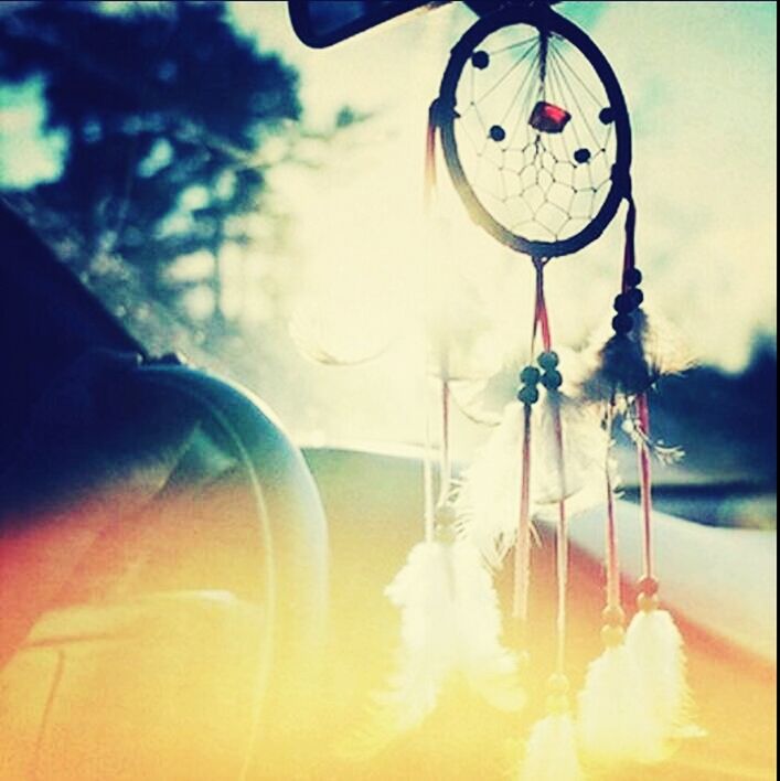 sky, technology, focus on foreground, close-up, transportation, glass - material, low angle view, lighting equipment, mode of transport, outdoors, day, reflection, time, no people, old-fashioned, retro styled, circle, part of, sunlight, transparent