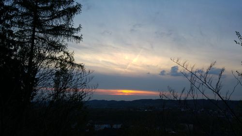 Scenic view of landscape against sky at sunset