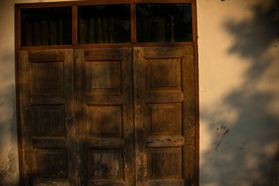 Closed wooden door of old building