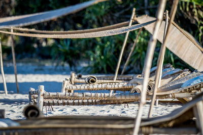 Close-up of camp beds on beach