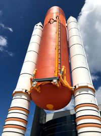 Low angle view of fuel storage tank against sky