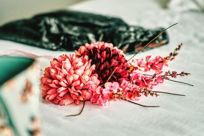 Close-up of red flowers on table