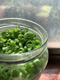 Close-up of vegetables in glass container on table