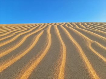 Waves of sand in desert