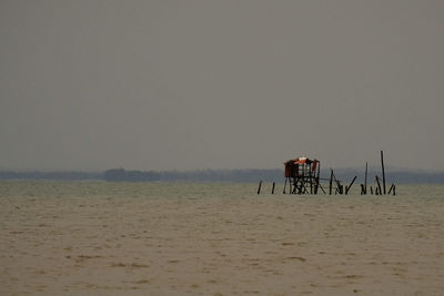 Scenic view of beach against clear sky