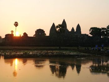 Scenic view of lake against orange sky