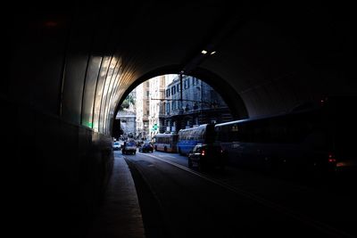 View of cars on road in tunnel