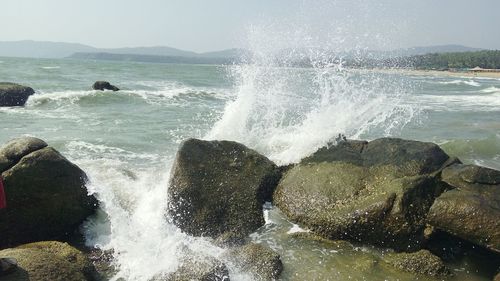 Waves splashing on rocks