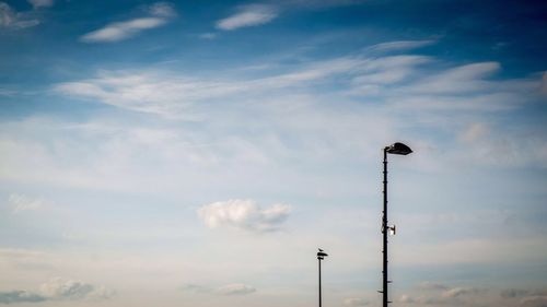 Low angle view of street light against sky