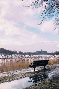 Scenic view of lake against sky during winter