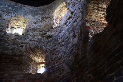 Low angle view of illuminated tunnel