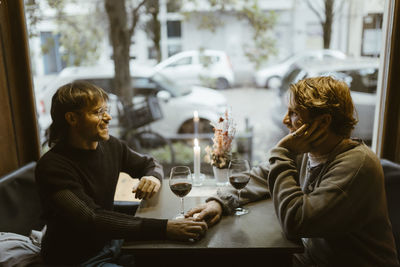 Female friends sitting at restaurant