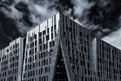 Low angle view of modern buildings against sky in city