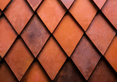 Close up texture of orange rhombus brick. wall for exterior or interior design.
