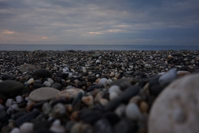 Scenic view of calm sea against cloudy sky