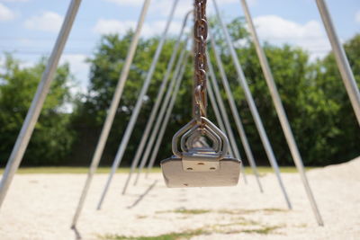 Close-up of padlocks on swing