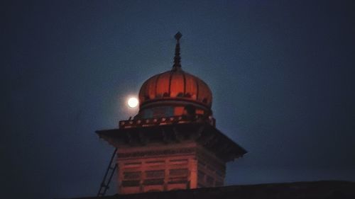 Low angle view of cathedral against clear sky at night