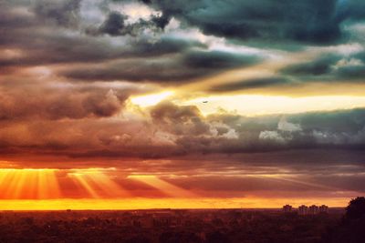Scenic view of landscape against cloudy sky