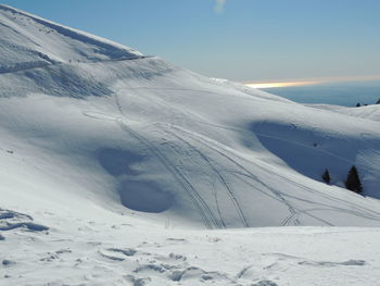 Snow covered mountain against sky