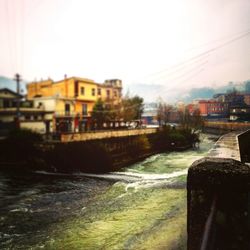 River in city against clear sky